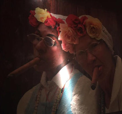 Image of 2 cuban women smoking cigar