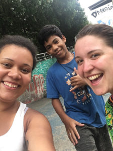 Safety in a Rio - Sarah & Marlie taking a selfie with a local boy from the favelas