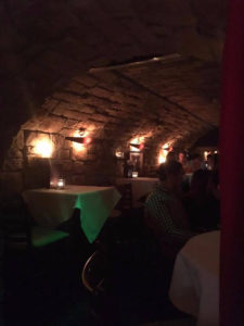 Dublin's best cocktail bar - Image of inside the cocktail bar featuring a low lit tunnel built with exposed brick