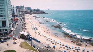 Beach in Salvador Brazil - Image overlooking large beach covered in umbrellas from above