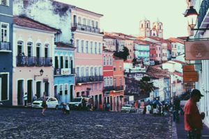 Pelourinho District Salvador Brazil. Image of cobbled street surrounded by large pastel coloured buildings.