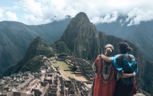 Two girls looking out over Machu Picchu