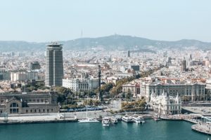 Image of skyscraper buildings next to a port - A Day in Barcelona