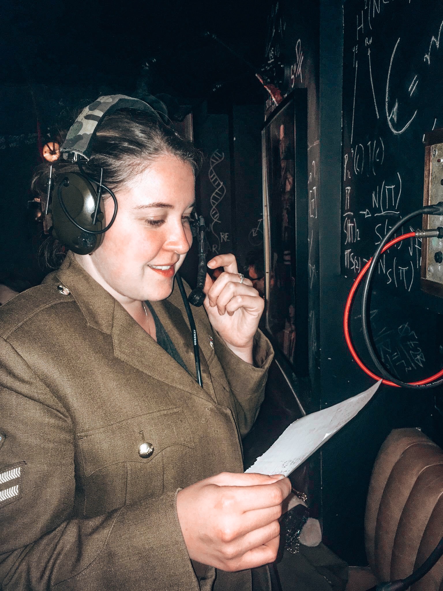 Unique Themed Cocktail Bars in London - Girl speaking into an old telephone wearing military uniform