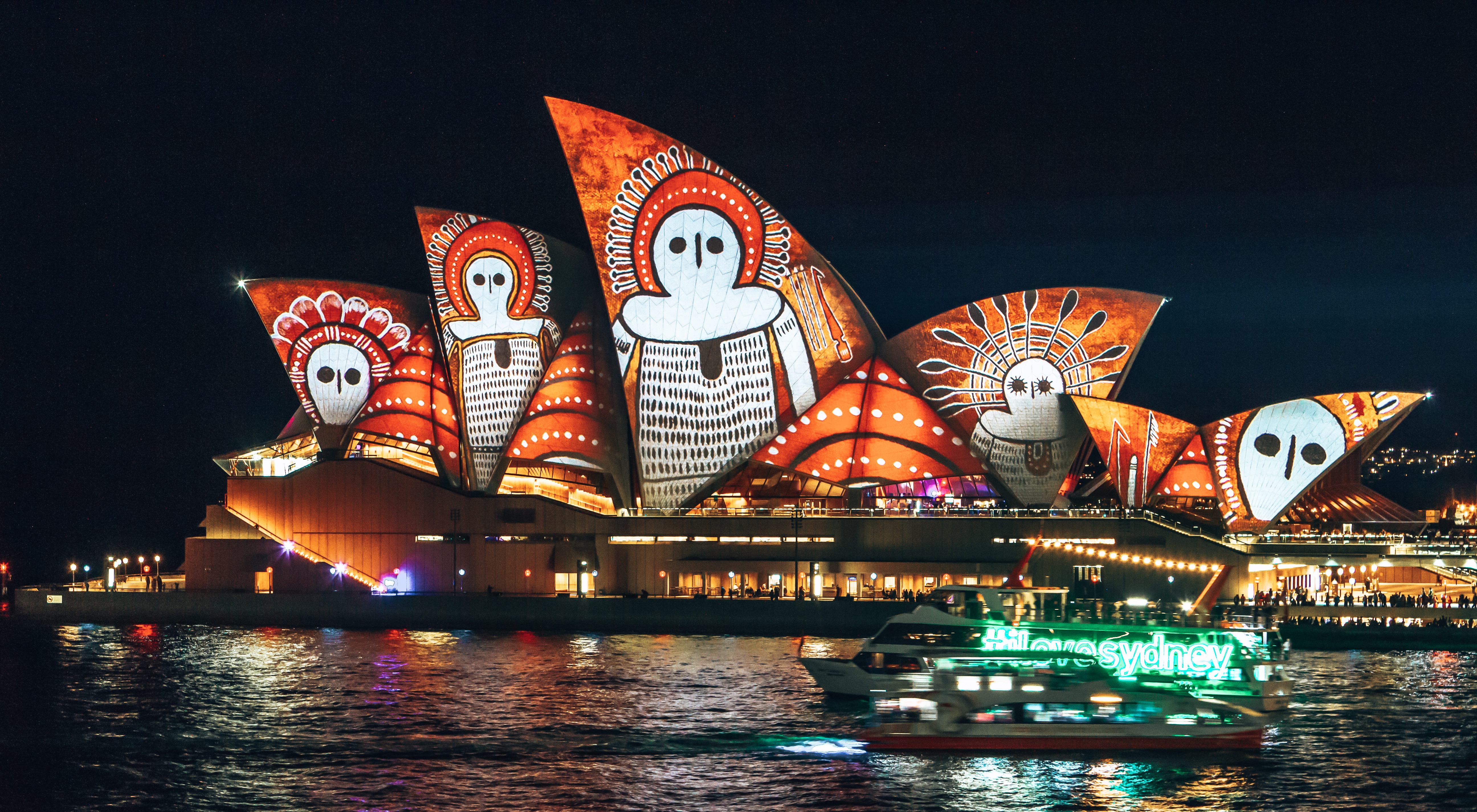 Sydney Opera House with light installation showing aboriginal art on the sails