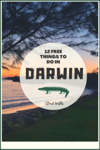12 Free Things to Do in Darwin - An image of a sunsetting over a beach - A transparent circle with text: 12 Free things to do in Darwin, A cartoon crocodile image below text and 'Cloud Walks'