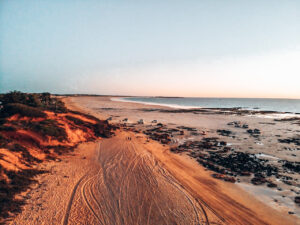 Broome - Birdseye image of an empty beach during sunset